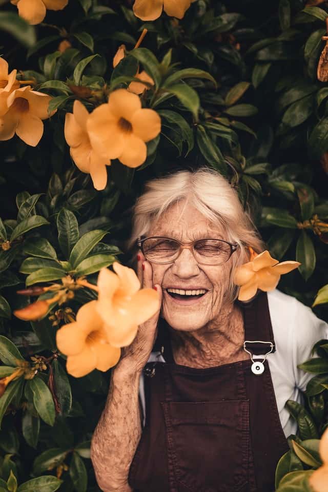 woman-standing-near-yellow-petaled-flower